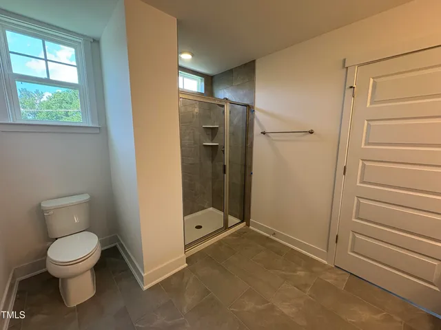 a living room with furniture fireplace and flat screen tv