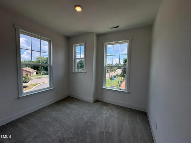 a large kitchen with white cabinets