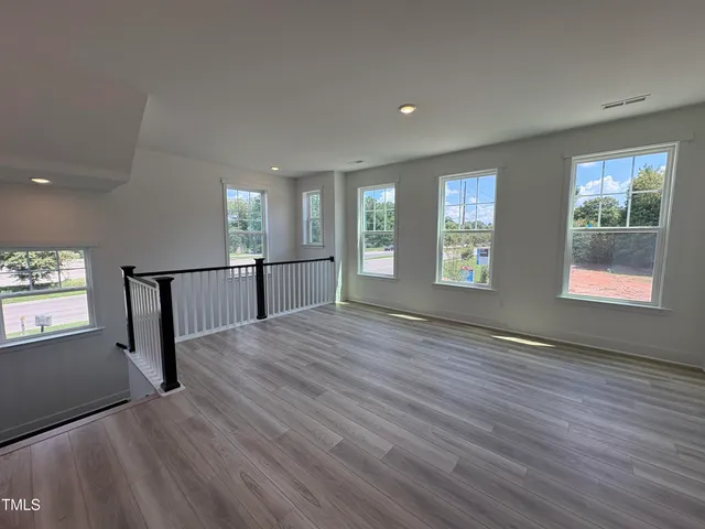 a view of a kitchen with a sink and cabinets