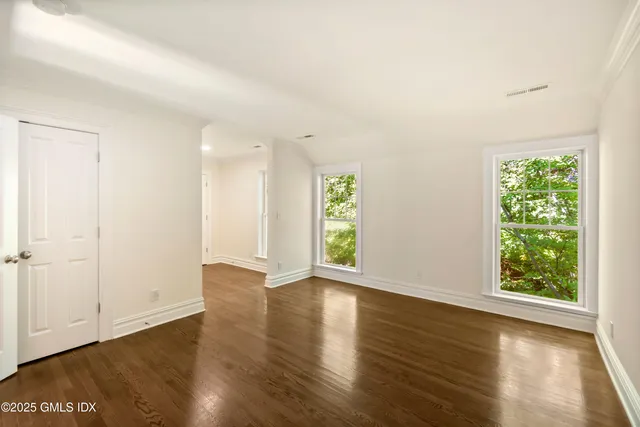 a view of a park with large trees