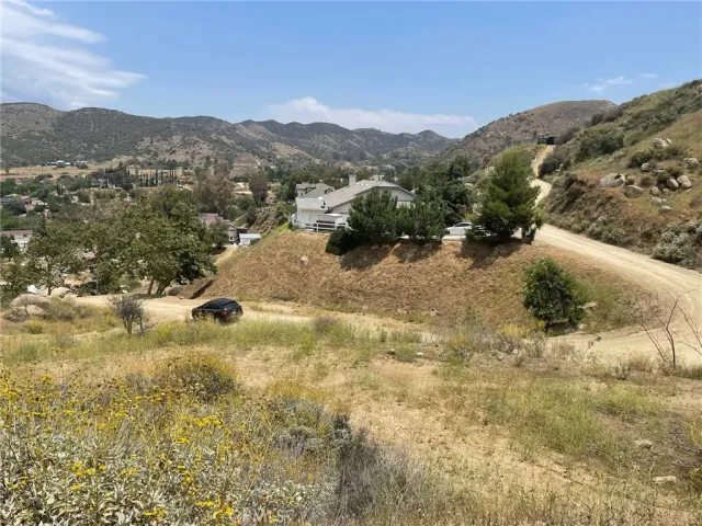 a view of a town with mountains in the background
