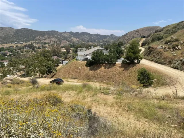 a view of a town with mountains in the background