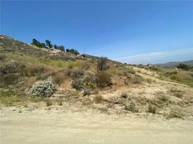 a view of a large mountains with mountains in the background