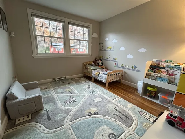 a bedroom with furniture and a window