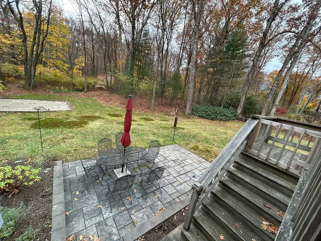 a view of a park with iron fence