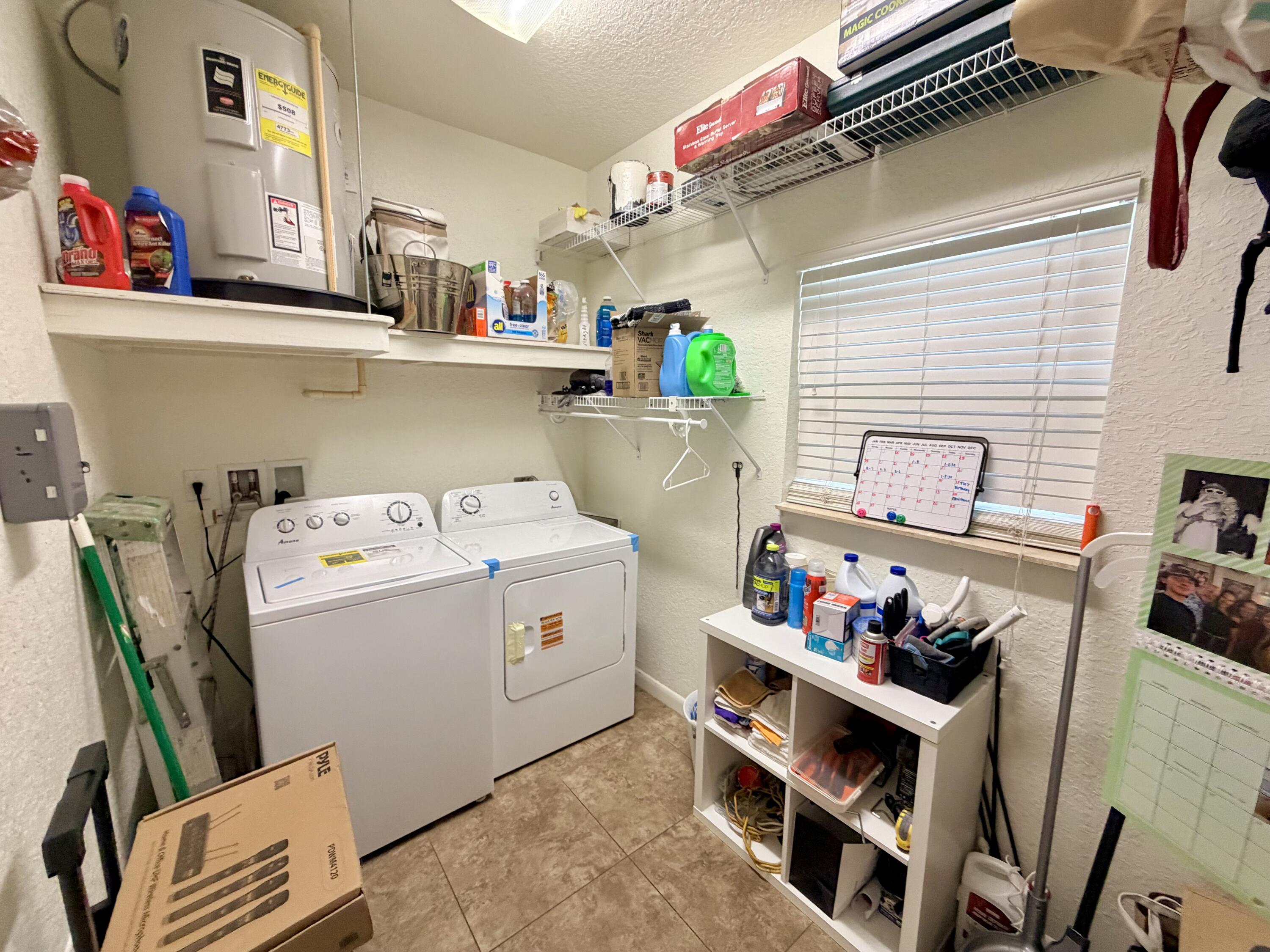 243 Southwest 5th Street Dania Beach, FL 33004 - Photo 11 of 18 a utility room with dryer and washer