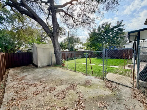 a view of a back yard with green space