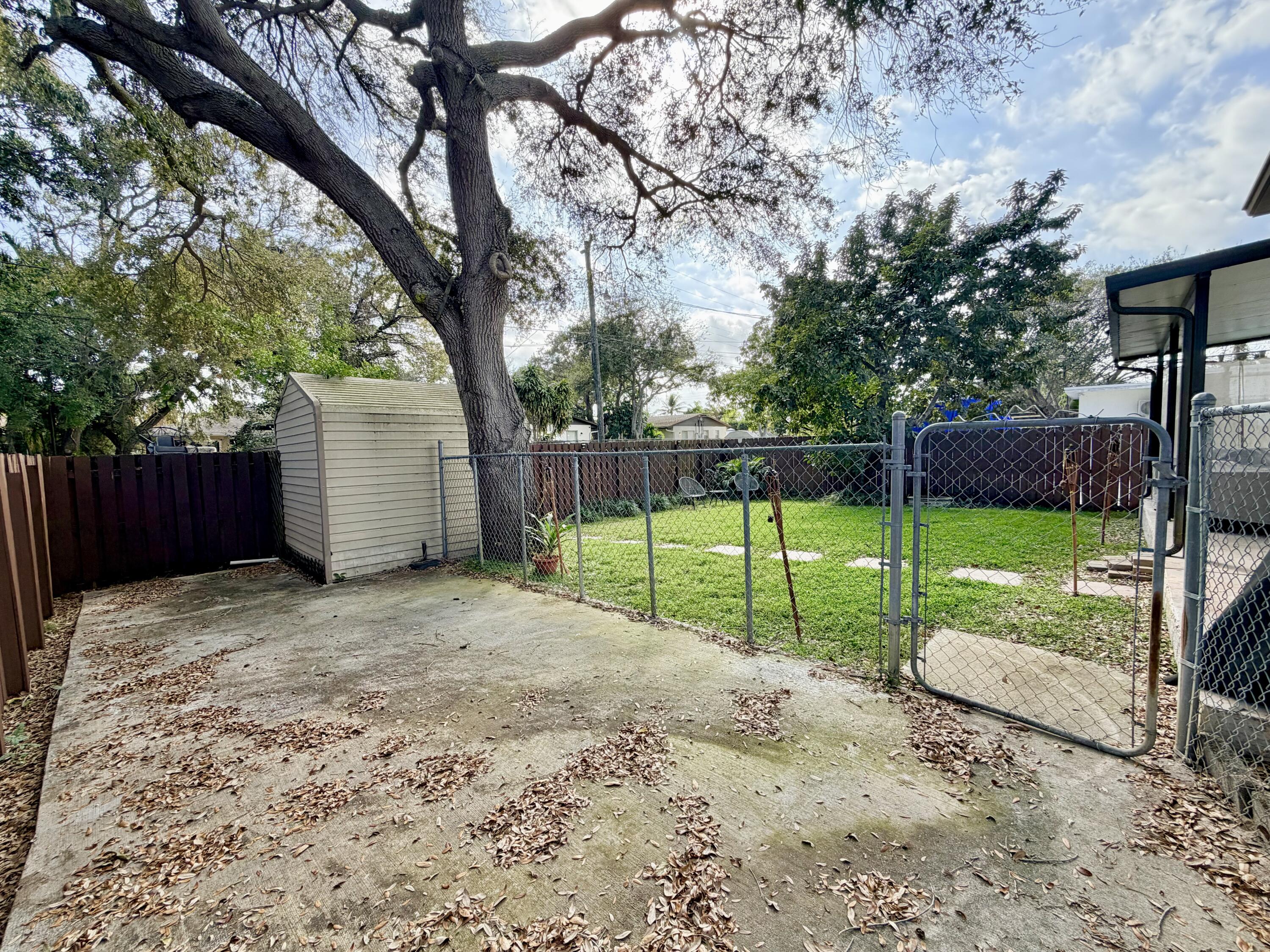 243 Southwest 5th Street Dania Beach, FL 33004 - Photo 14 of 18 a view of a back yard with green space
