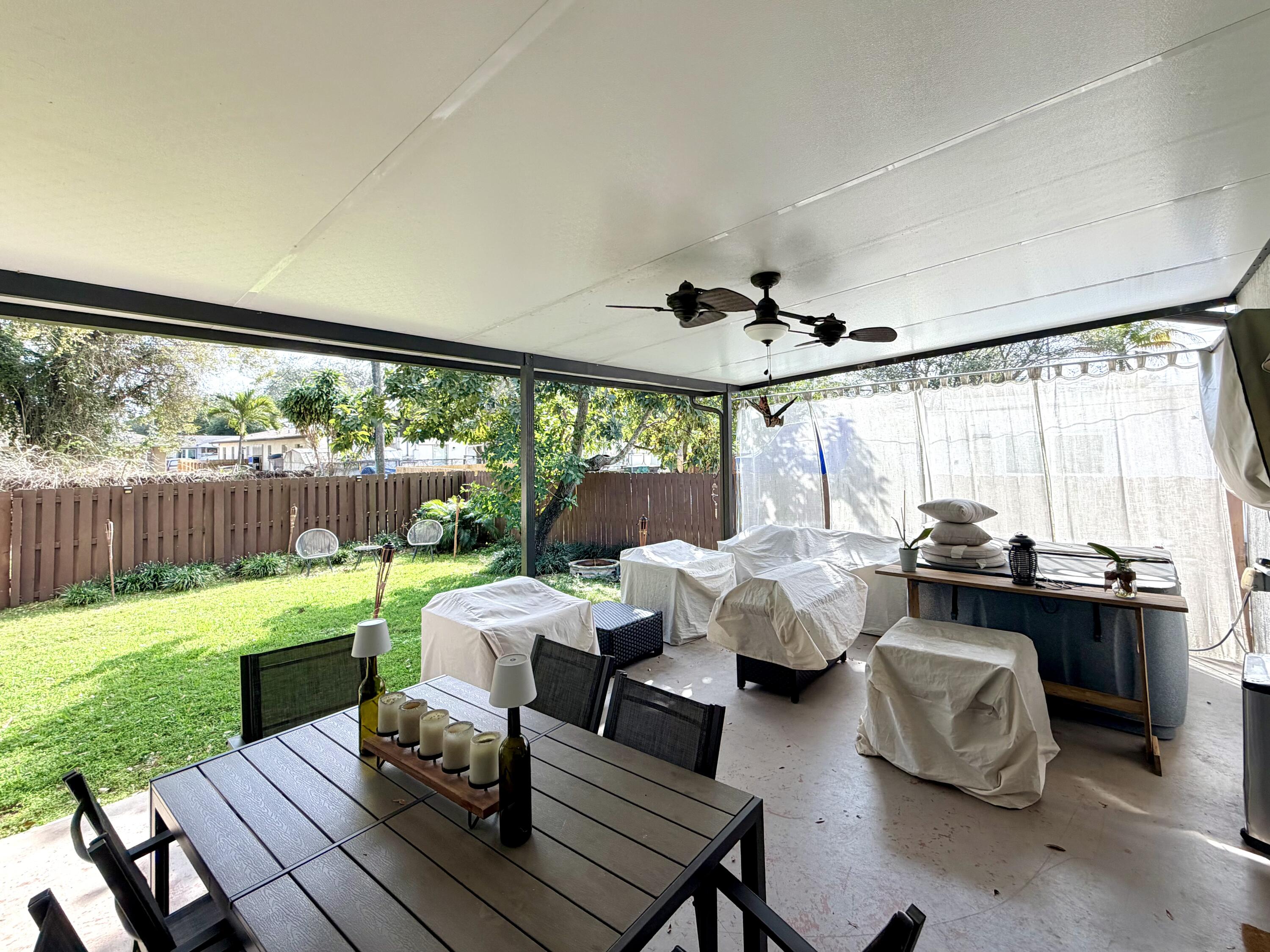243 Southwest 5th Street Dania Beach, FL 33004 - Photo 17 of 18 a outdoor living space with furniture and garden view
