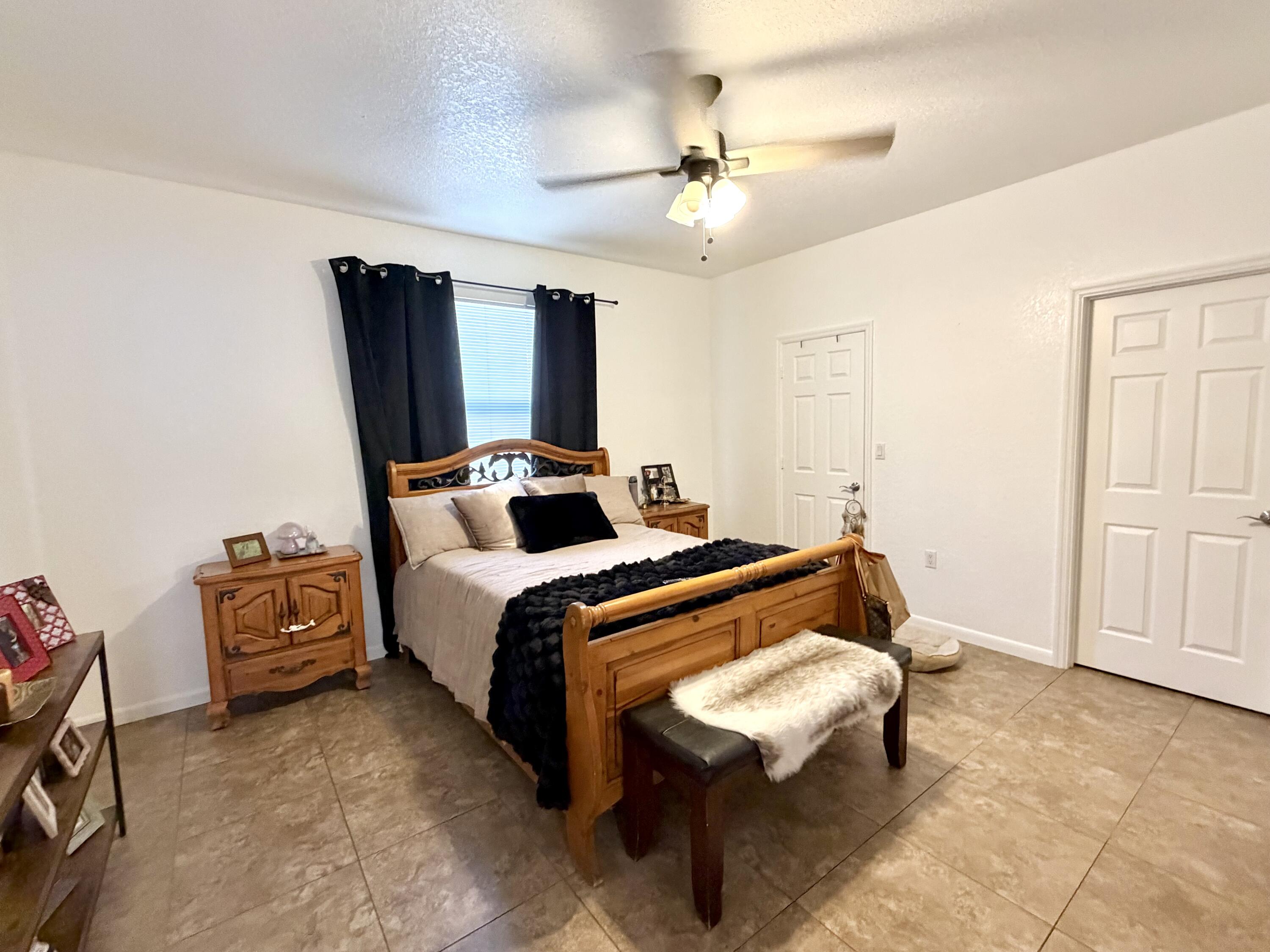 243 Southwest 5th Street Dania Beach, FL 33004 - Photo 6 of 18 a bedroom with bed and window