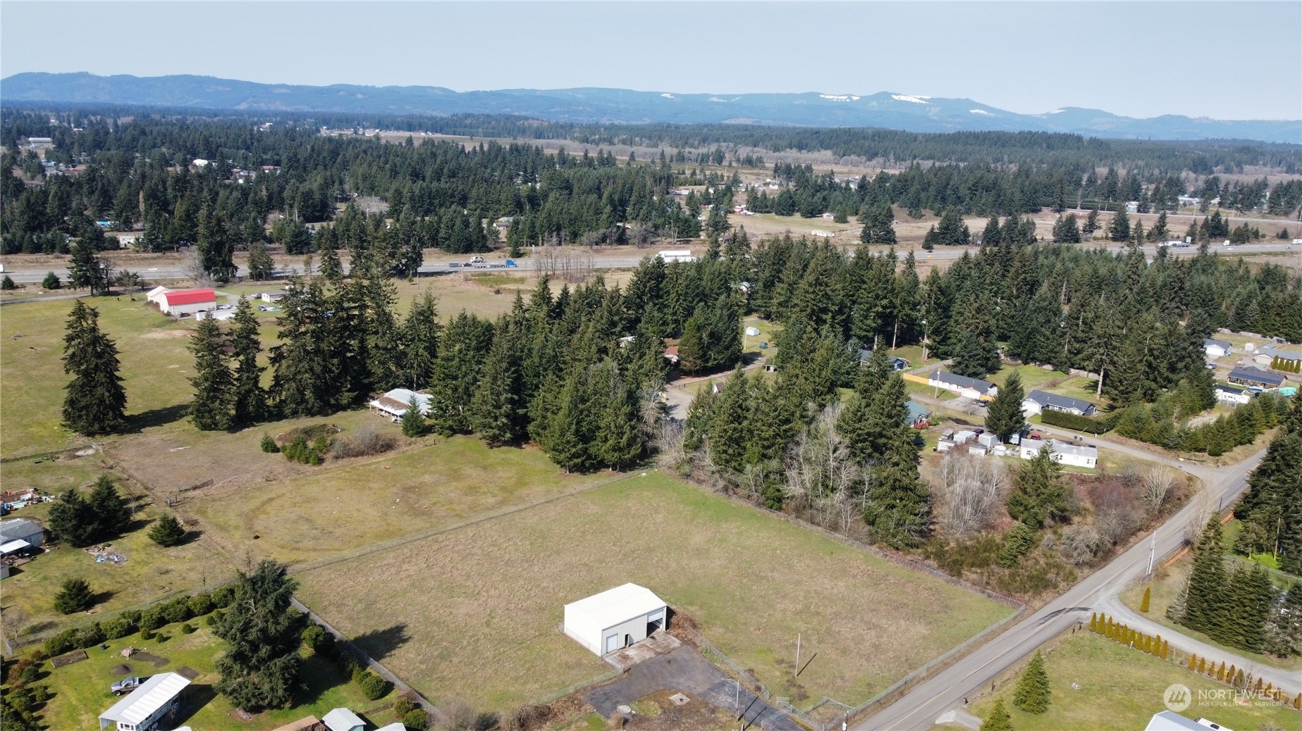 18911 Loganberry Street Southwest Rochester, WA 98579 - Photo 1 of 5 a view of a outdoor space
