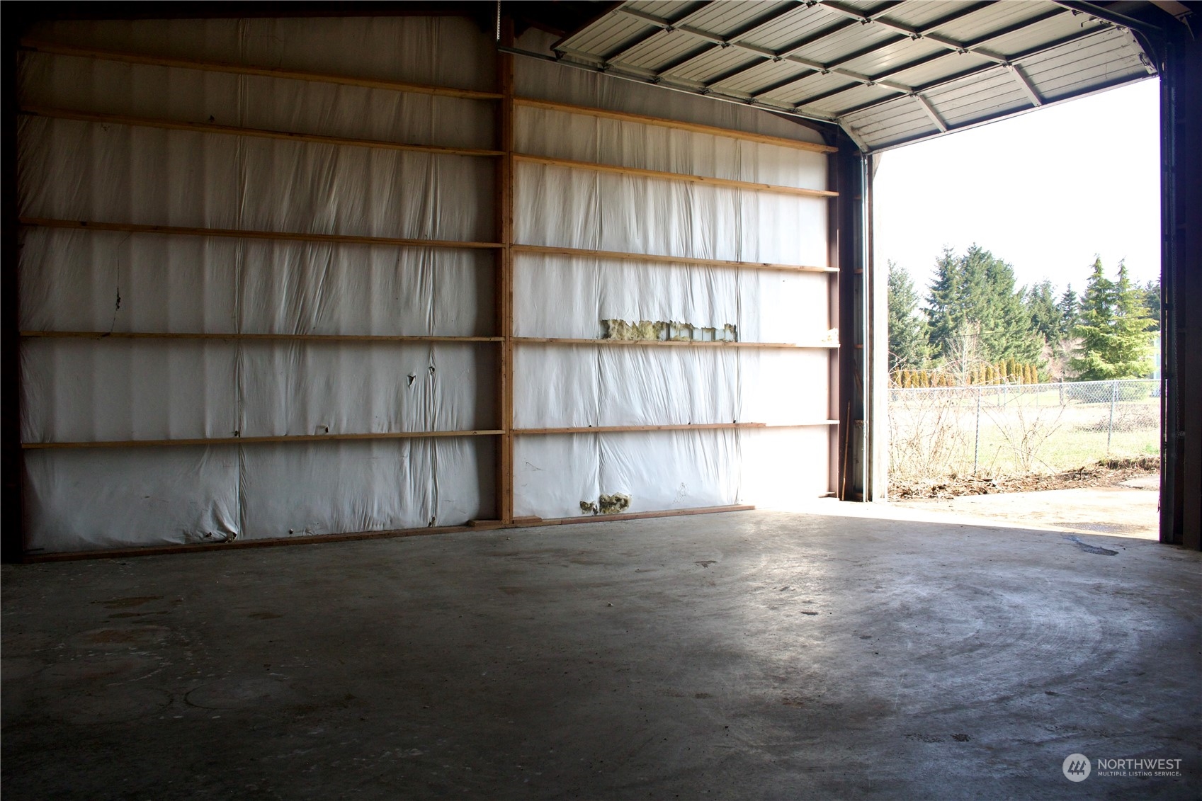 18911 Loganberry Street Southwest Rochester, WA 98579 - Photo 3 of 5 a view of an empty room with a window