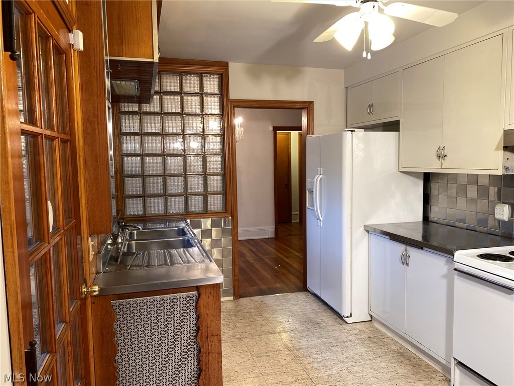5875 Mill Road Broadview Heights, OH 44147 - Photo 10 of 31 Kitchen with metal backsplash, double sink and appliances.