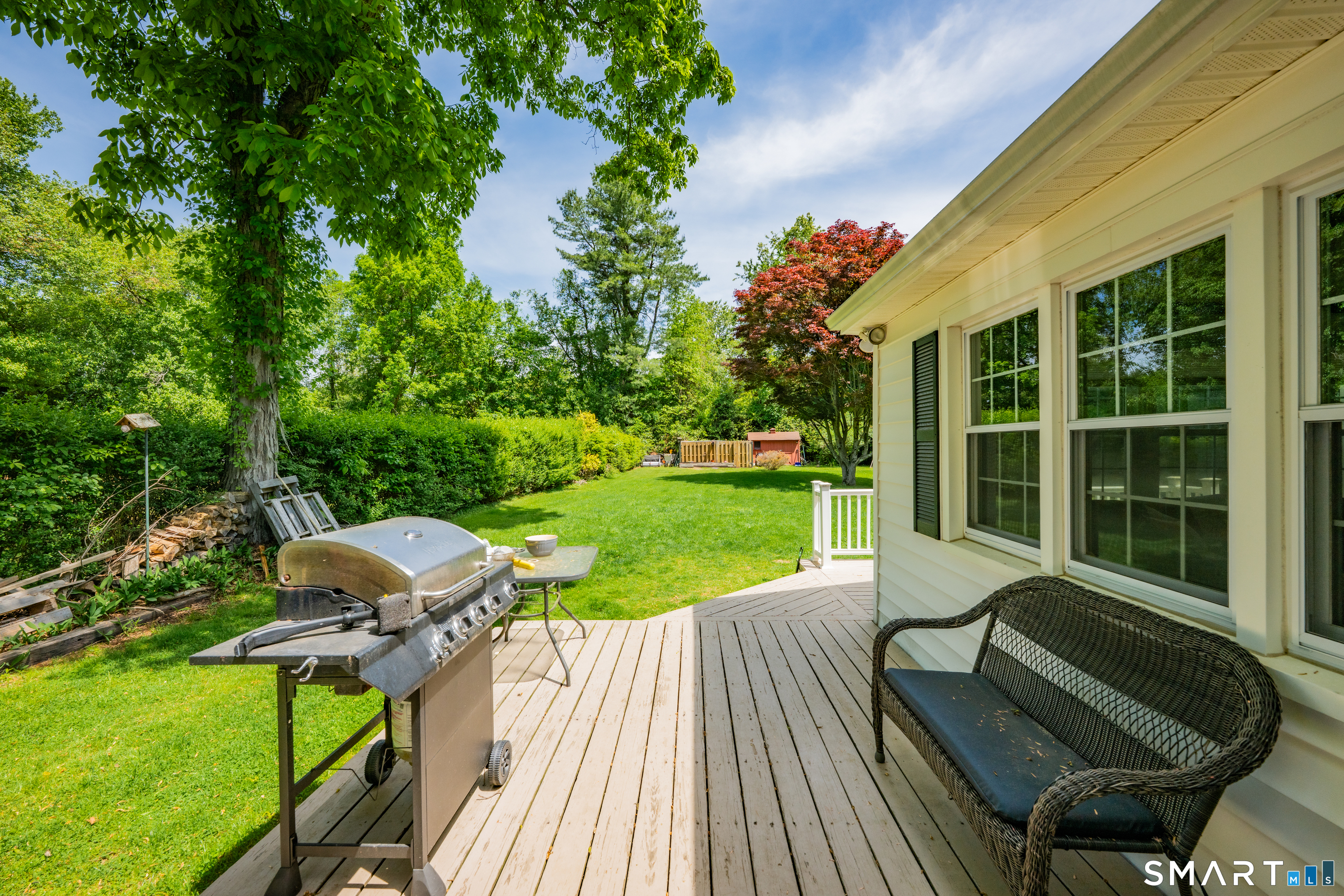 2 Hemlock Road Prospect, CT 06712 - Photo 21 of 27 a view of a chair and tables in the backyard of the house