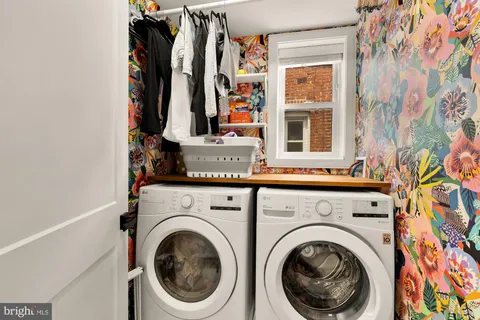 a view of a hallway with washer and dryer