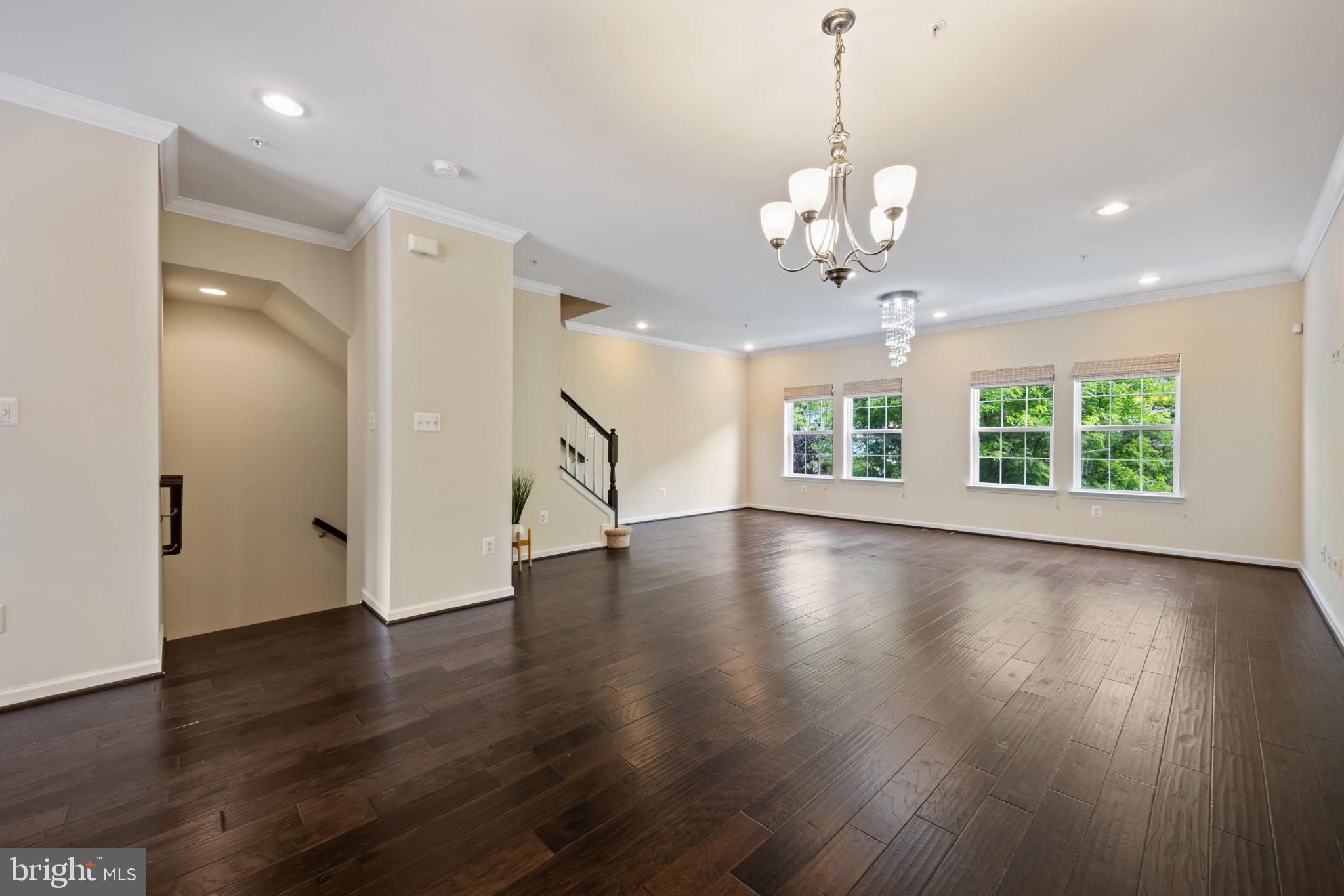 7062 Foxton Way Hanover, MD 21076 - Photo 15 of 41 an empty room with wooden floor and windows