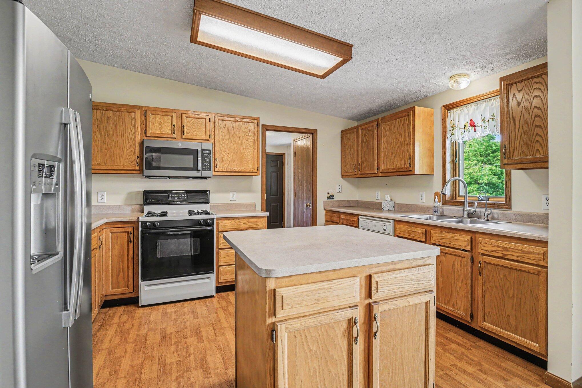 69728 Calvin Center Road Edwardsburg, MI 49112 - Photo 5 of 26 69728 Calvin Center Rd. Kitchen Island