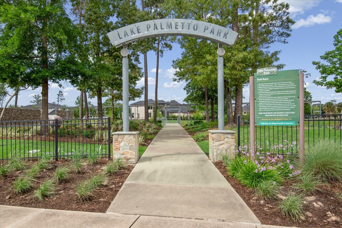 17814 Tree Of Heaven Conroe, TX 77385 - Photo 39 of 48 East Village - Lake Palmetto Park - Offering a scenic lake with fly fishing opportunities at the zero entry pebble beach, wildlife garden, playground, picnic area, community trail system, Lake Palmetto Park, natural play areas, benches, a pedestrian bridge over the lake and additional park areas.