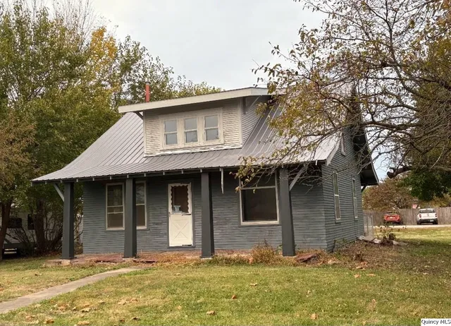 a house with trees in the background