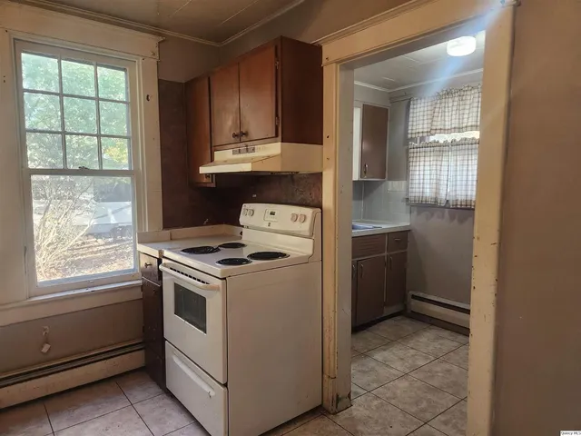 a kitchen with a stove and a sink