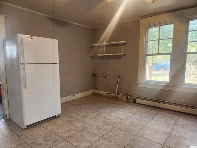 a view of empty room with windows