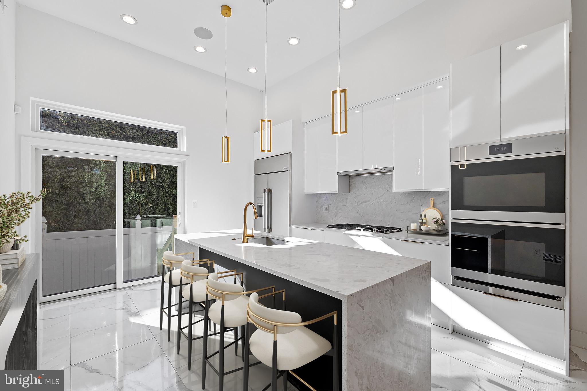 2130 Spring Street Philadelphia, PA 19103 - Photo 14 of 59 a kitchen with a stove a sink and a refrigerator