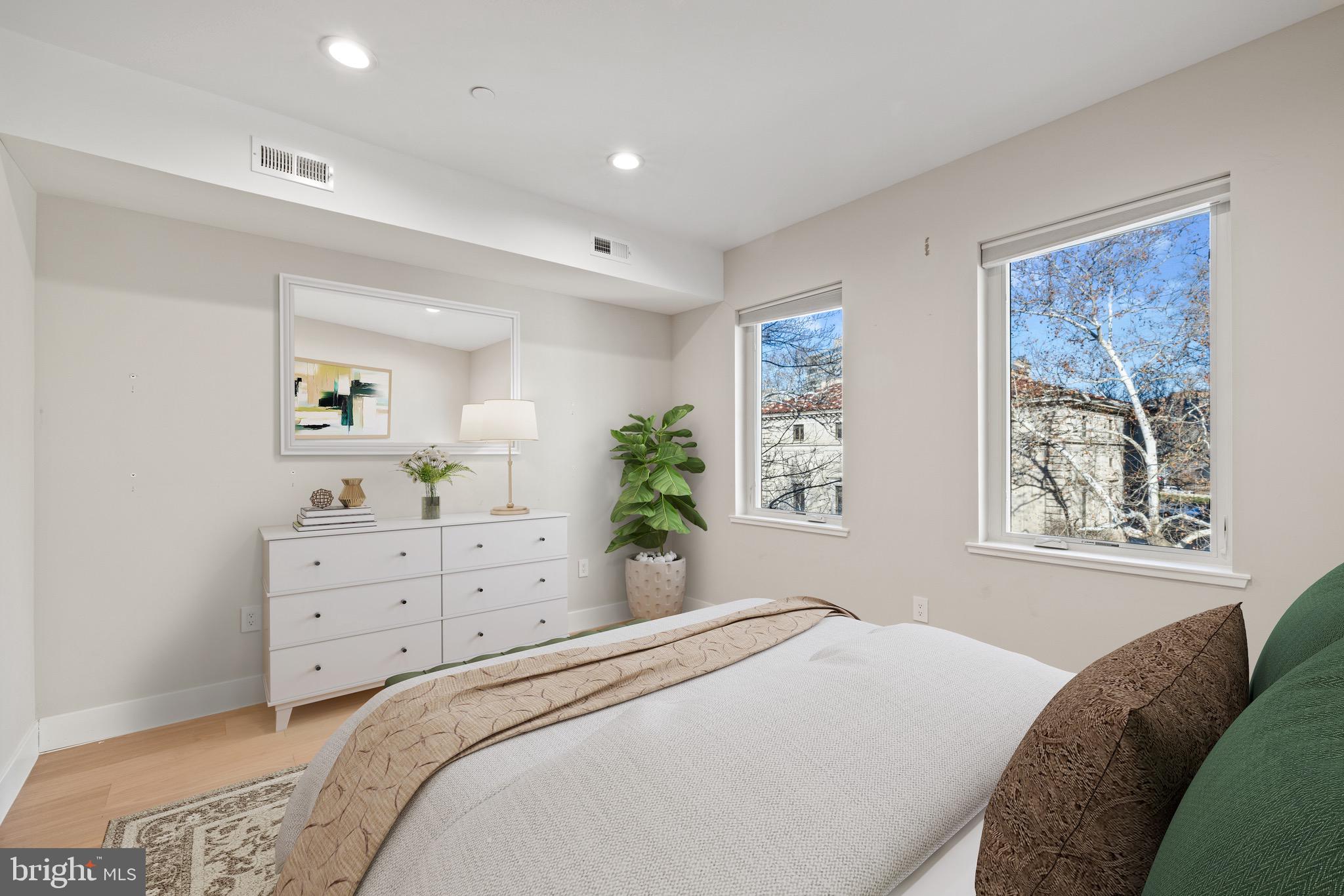 2130 Spring Street Philadelphia, PA 19103 - Photo 18 of 59 a bedroom with a bed and a window