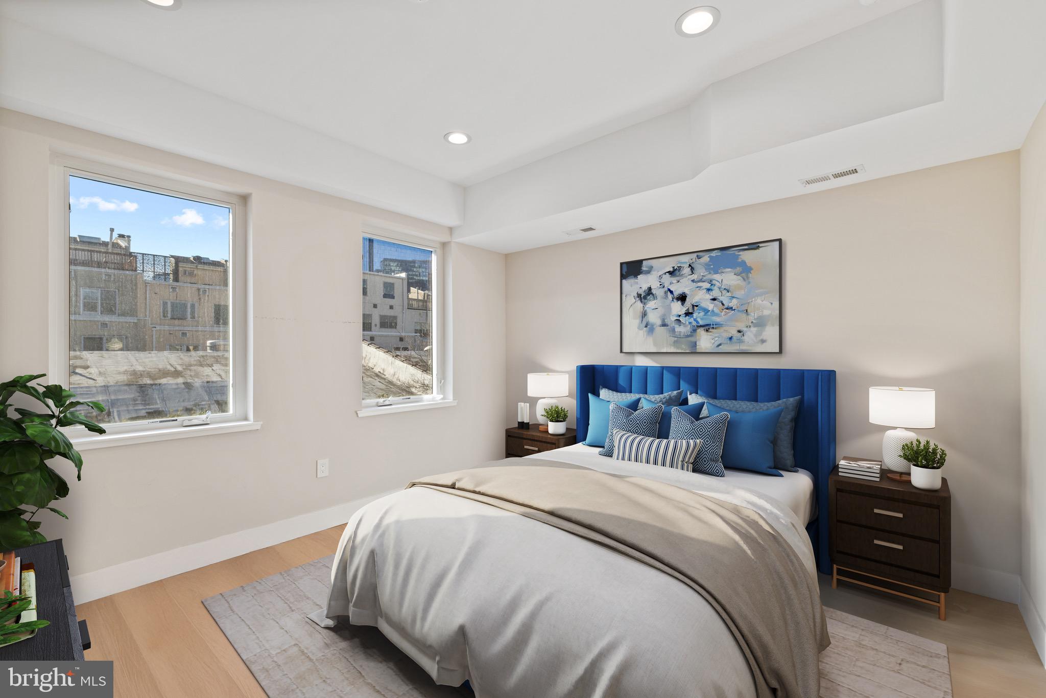 2130 Spring Street Philadelphia, PA 19103 - Photo 22 of 59 a bed sitting in a bedroom next to a window