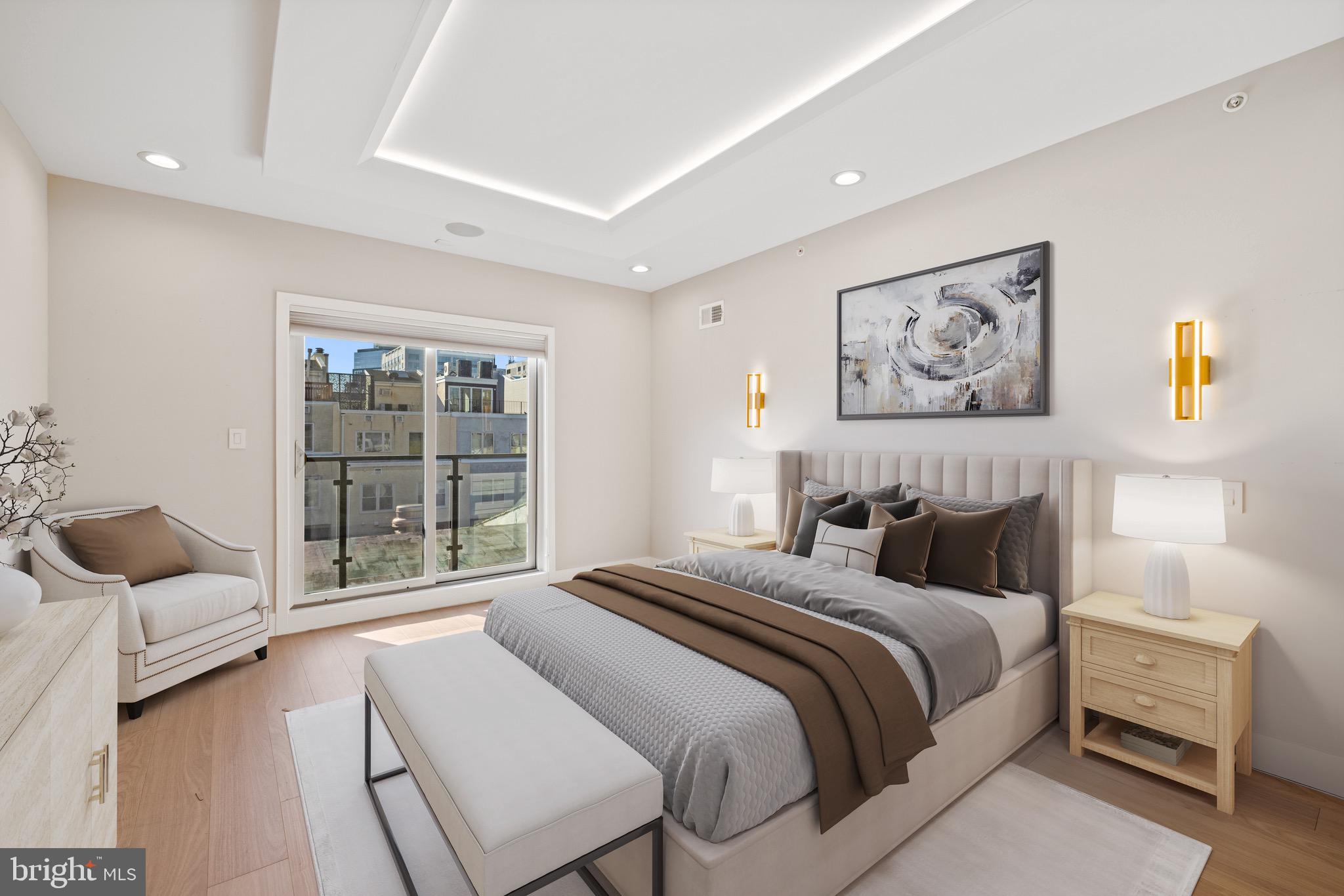 2130 Spring Street Philadelphia, PA 19103 - Photo 27 of 59 a bedroom with a bed and a large window