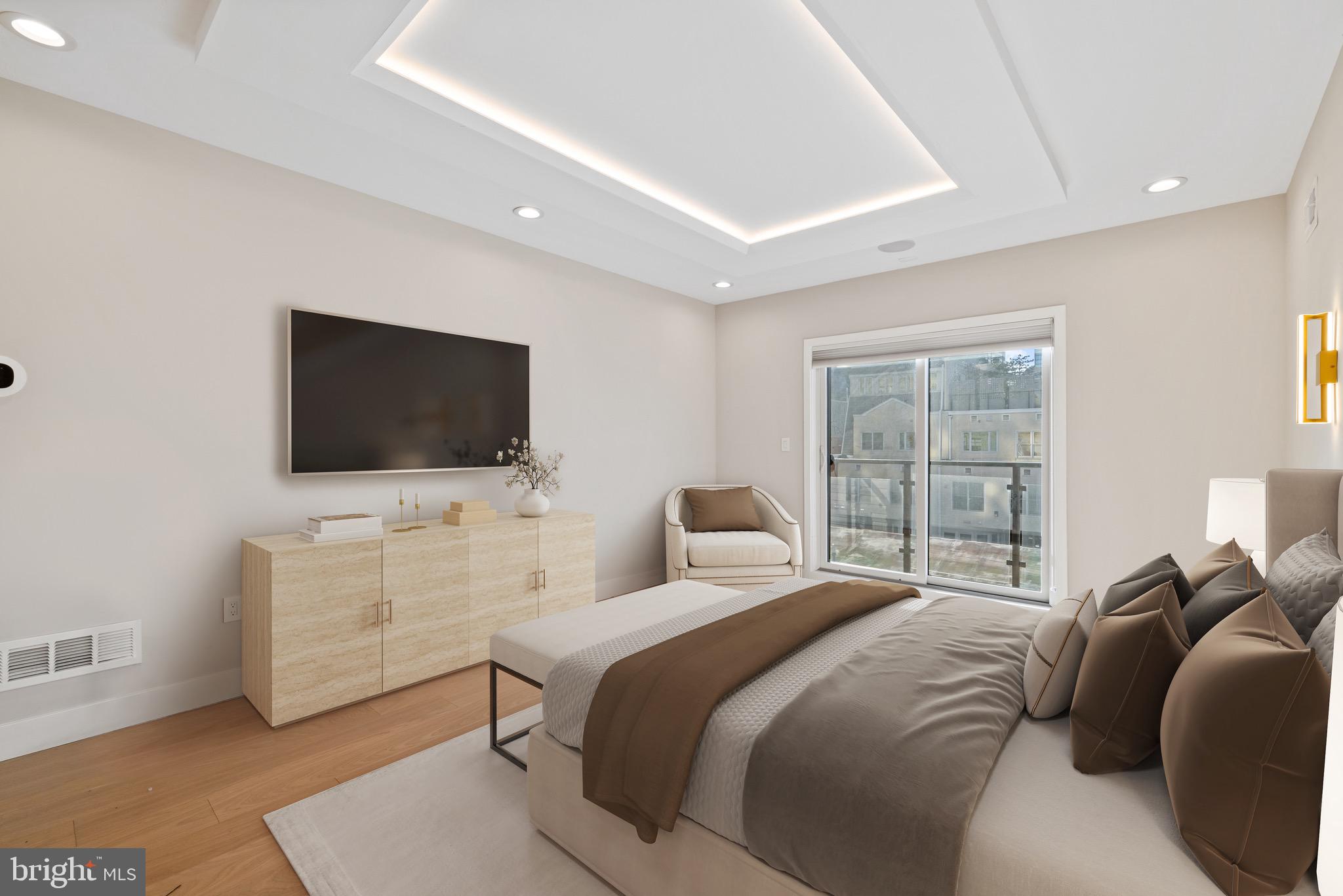 2130 Spring Street Philadelphia, PA 19103 - Photo 29 of 59 a bedroom with a bed and a flat screen tv