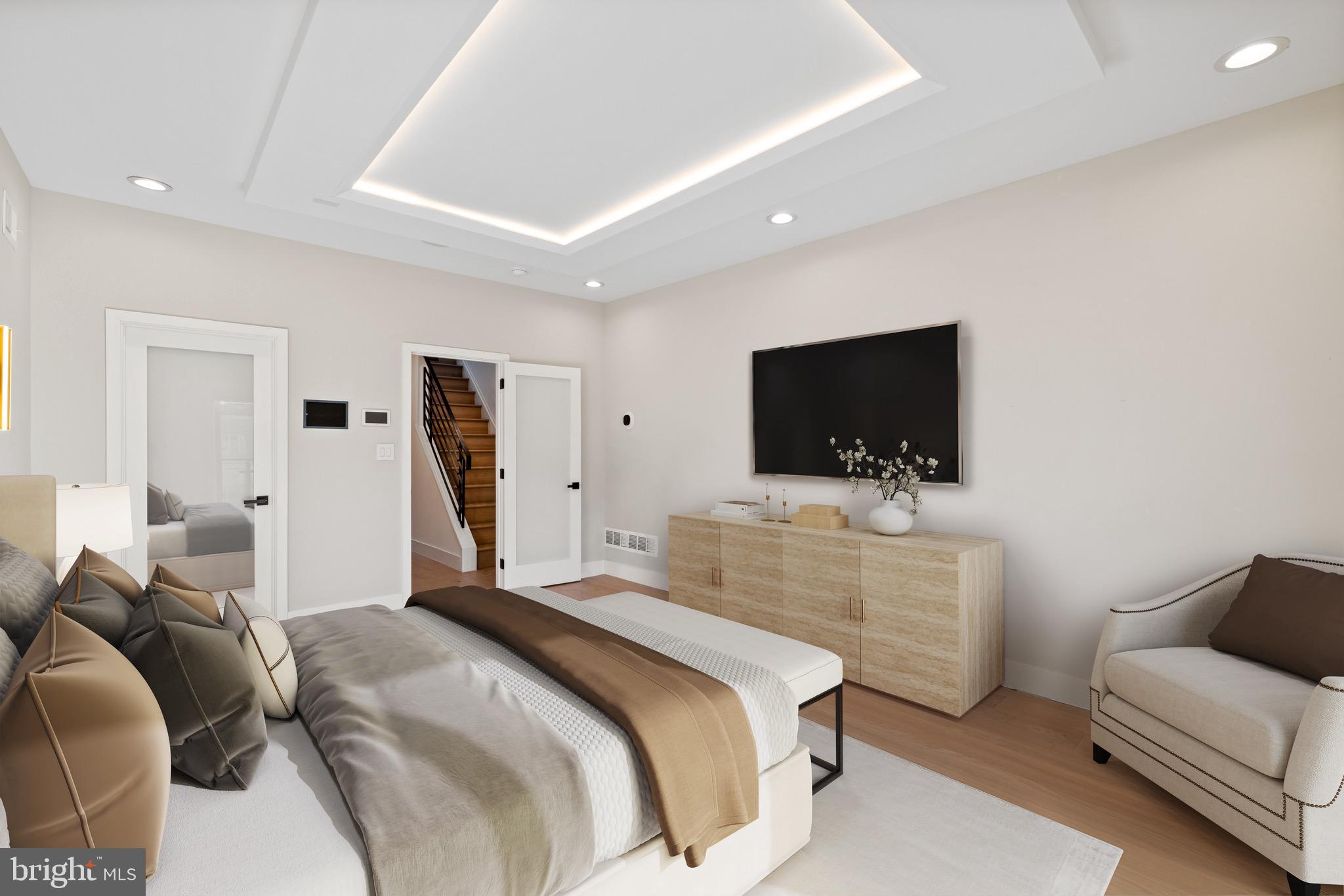 2130 Spring Street Philadelphia, PA 19103 - Photo 31 of 59 a bedroom with a bed and a flat screen tv