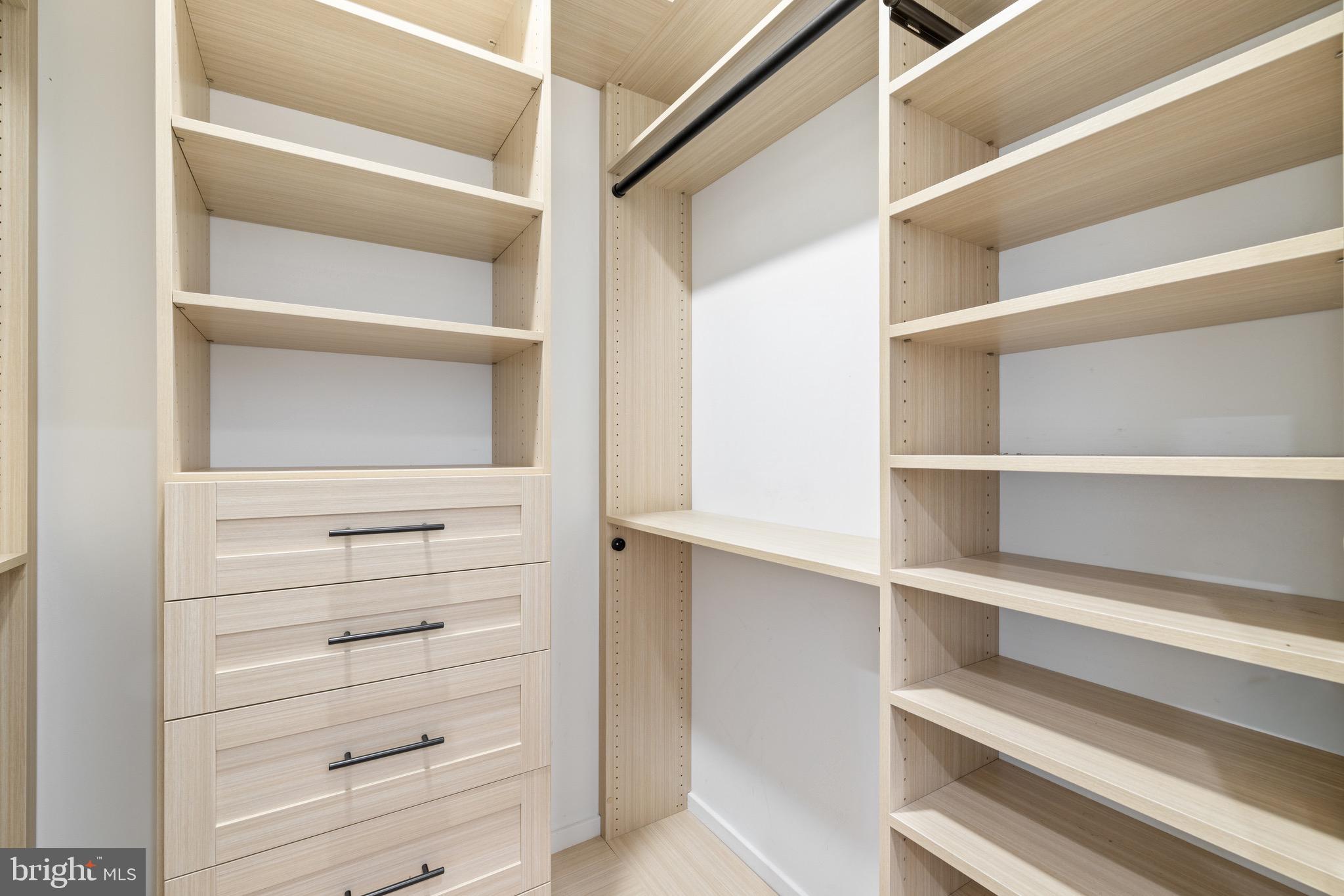 2130 Spring Street Philadelphia, PA 19103 - Photo 32 of 59 a view of walk in closet with empty racks