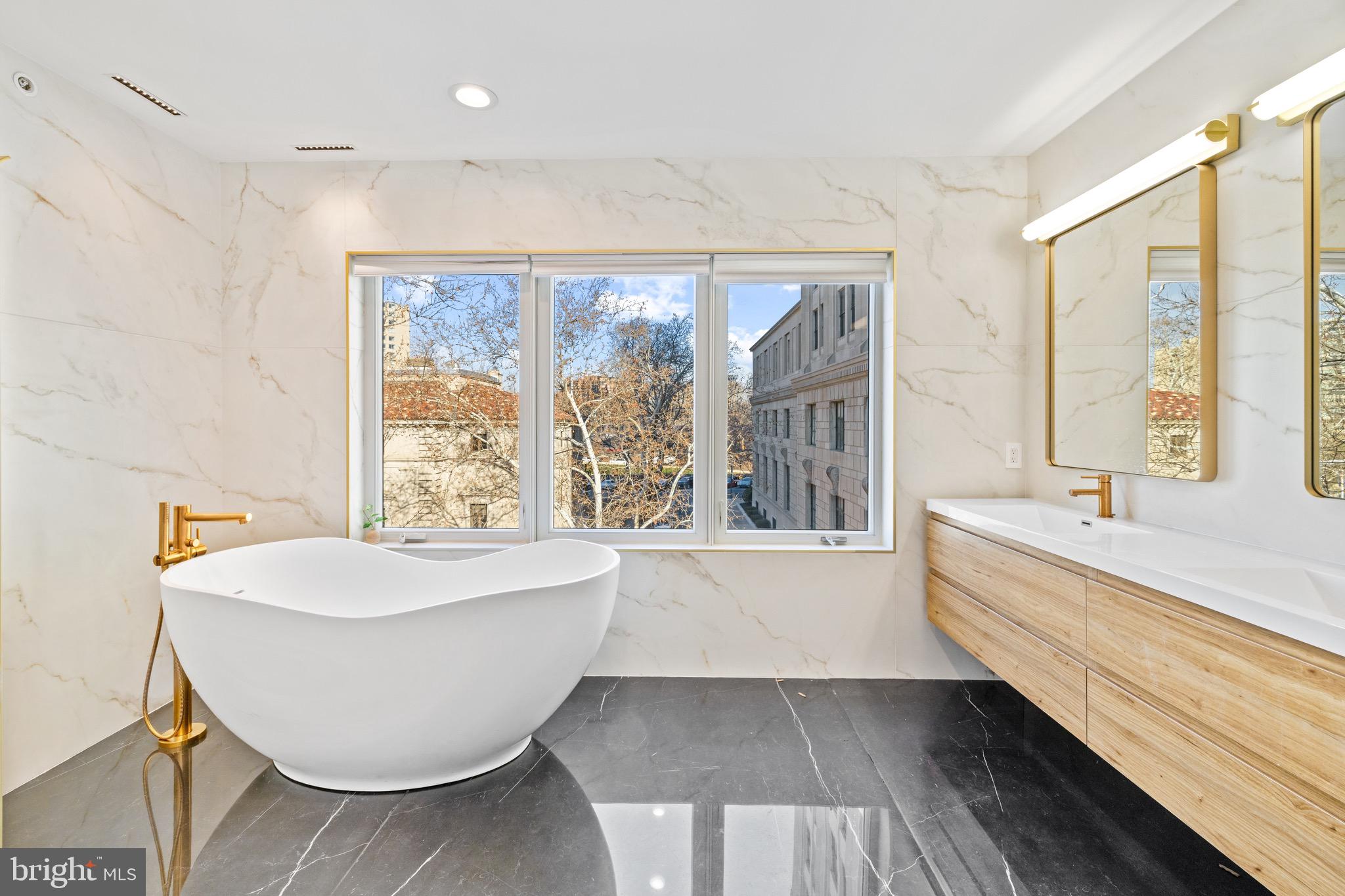 2130 Spring Street Philadelphia, PA 19103 - Photo 35 of 59 a bathroom with a bathtub and a sink