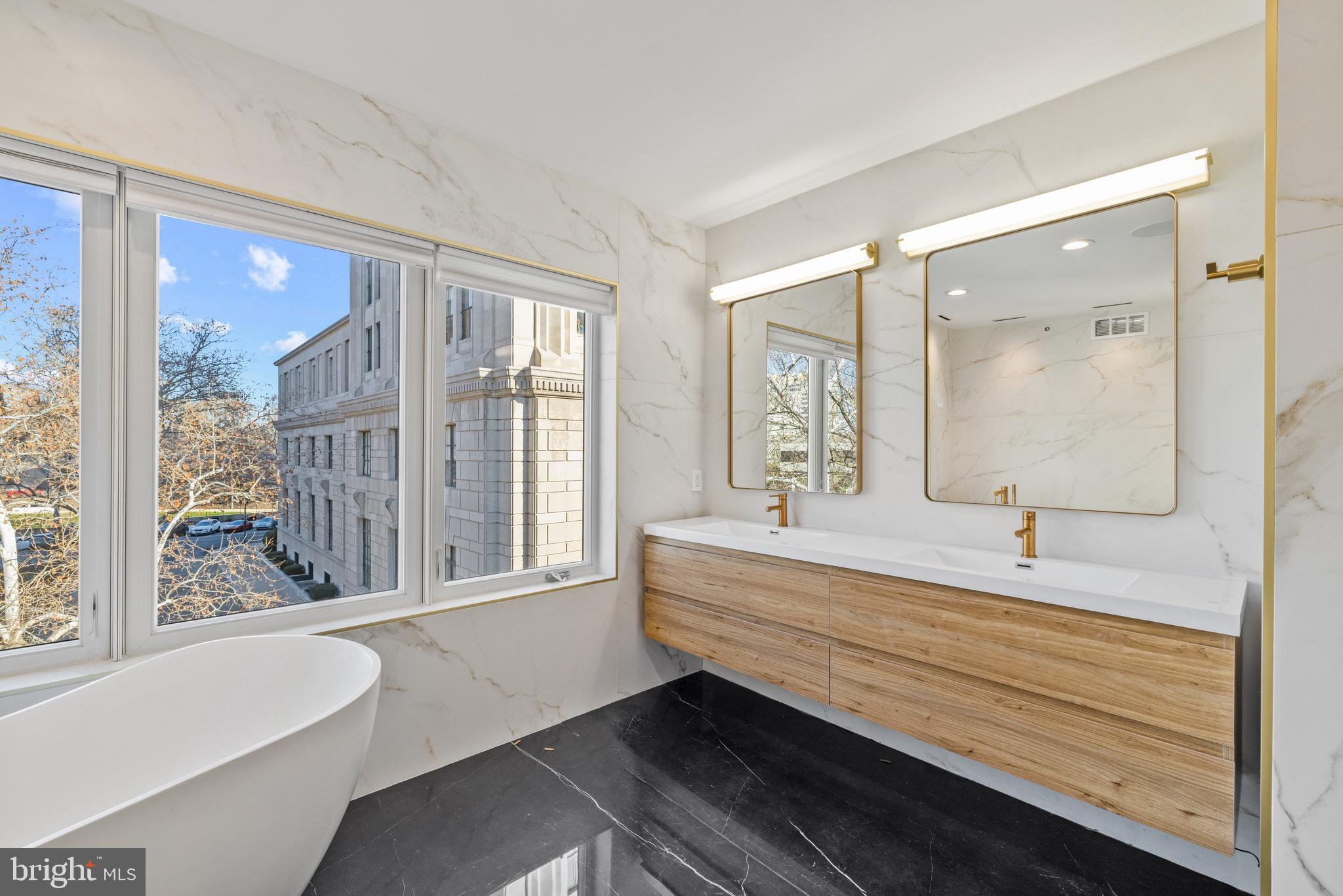 2130 Spring Street Philadelphia, PA 19103 - Photo 36 of 59 a bathroom with a bathtub and a sink