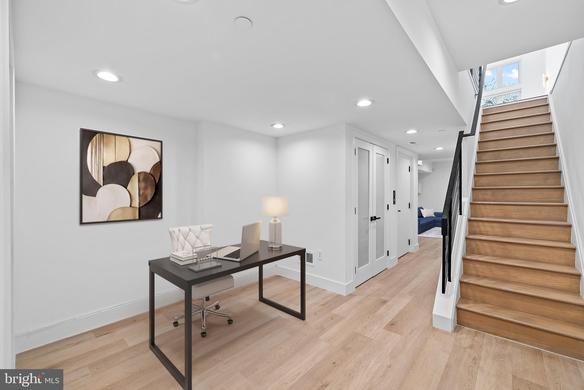 2130 Spring Street Philadelphia, PA 19103 - Photo 38 of 59 a workspace with furniture and wooden floor