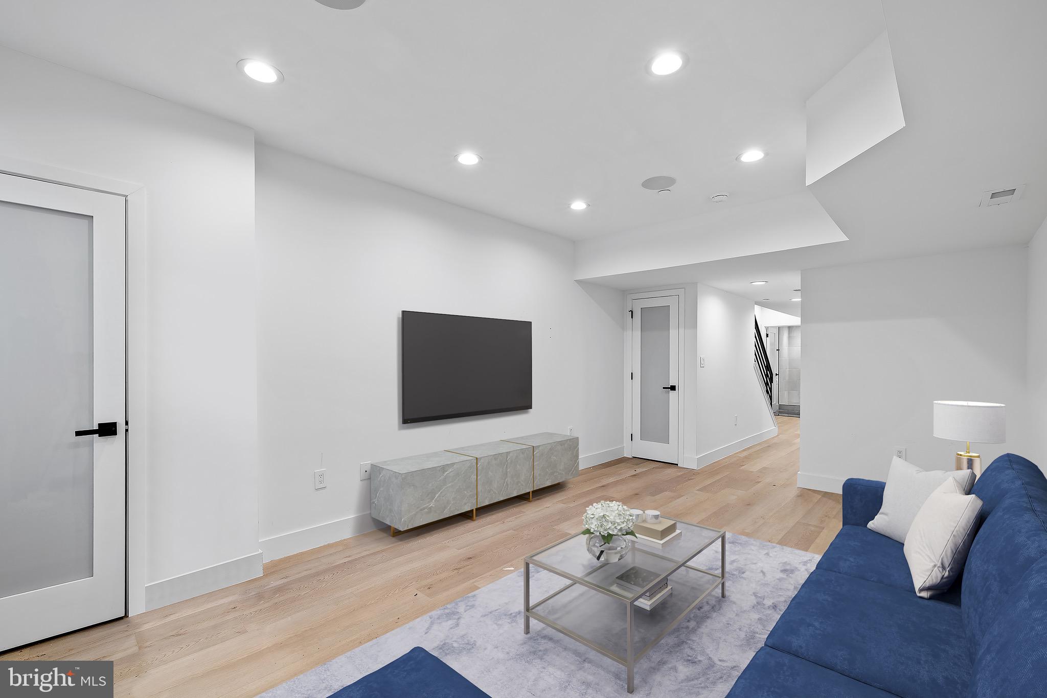 2130 Spring Street Philadelphia, PA 19103 - Photo 39 of 59 a living room with furniture and a flat screen tv