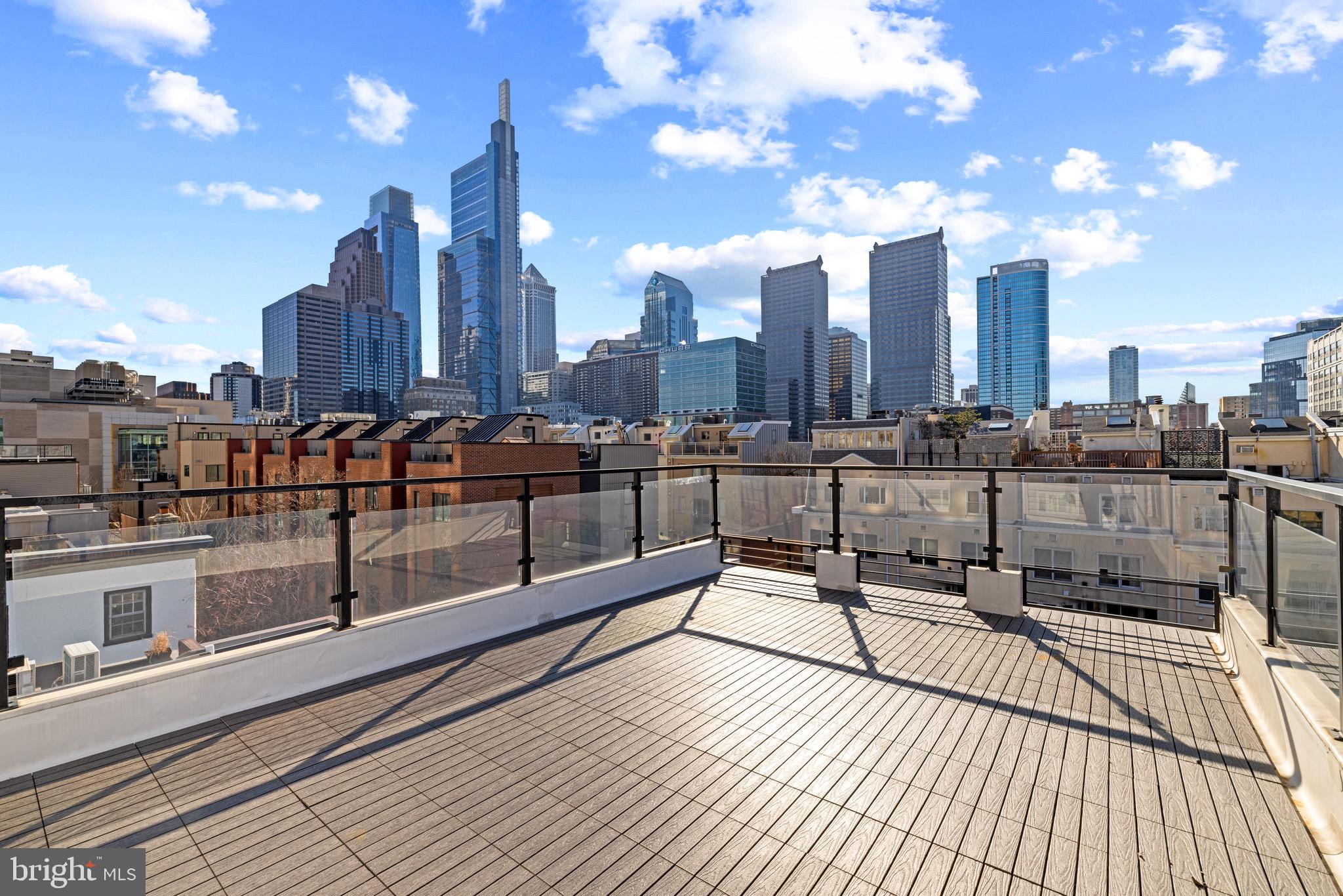 2130 Spring Street Philadelphia, PA 19103 - Photo 4 of 59 a view of a terrace with wooden benches