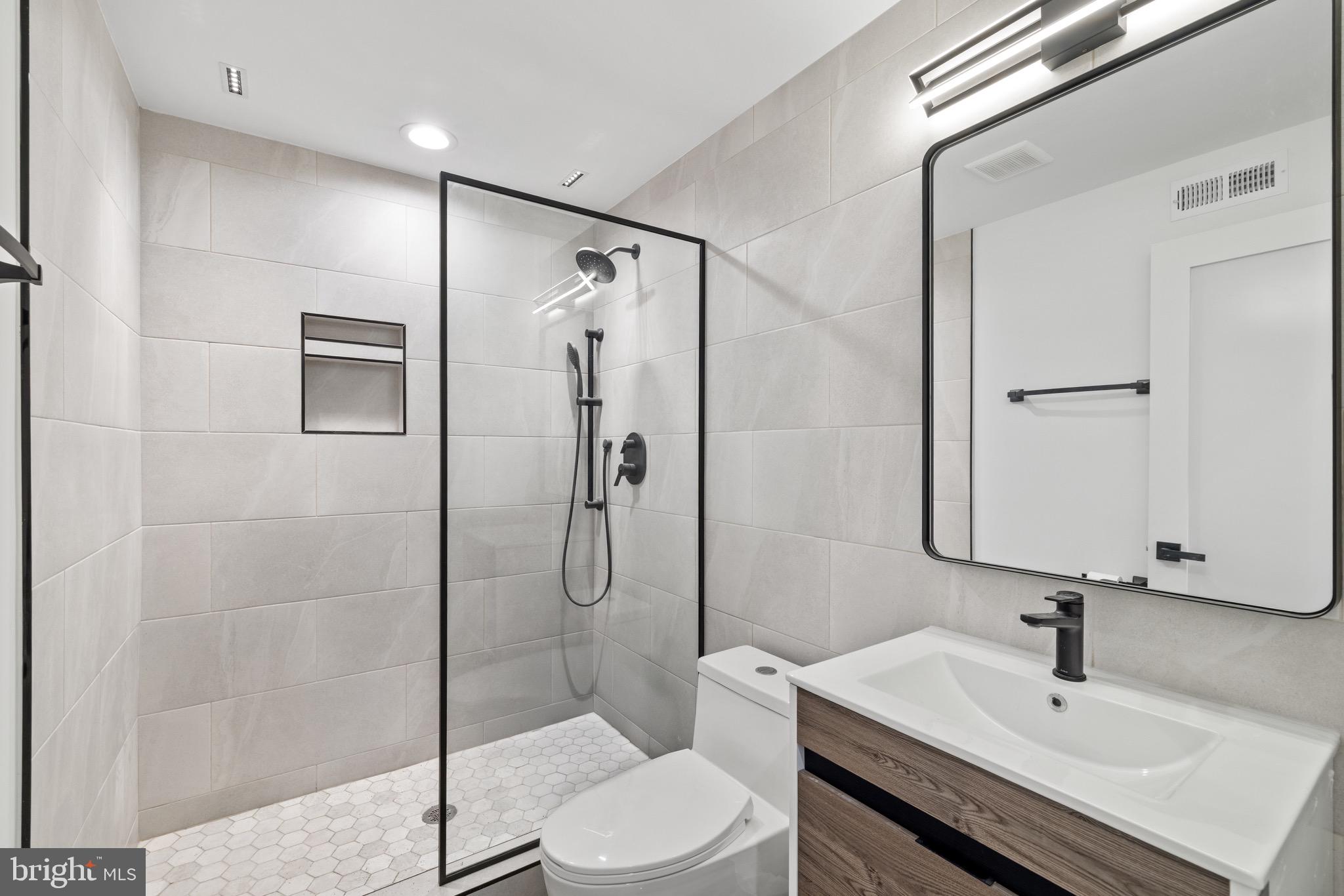 2130 Spring Street Philadelphia, PA 19103 - Photo 43 of 59 a bathroom with a sink toilet and shower