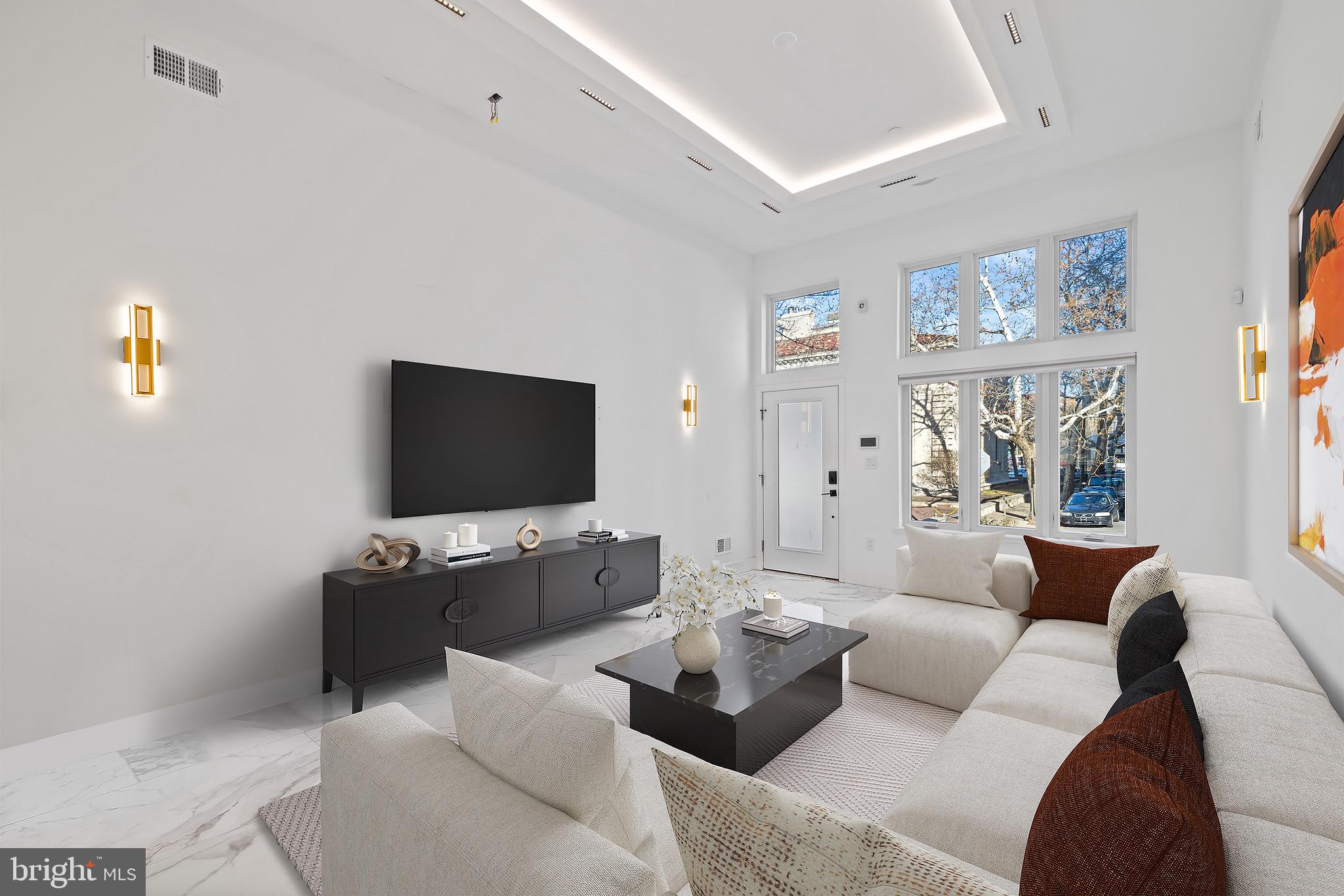 2130 Spring Street Philadelphia, PA 19103 - Photo 5 of 59 a living room with furniture and a flat screen tv