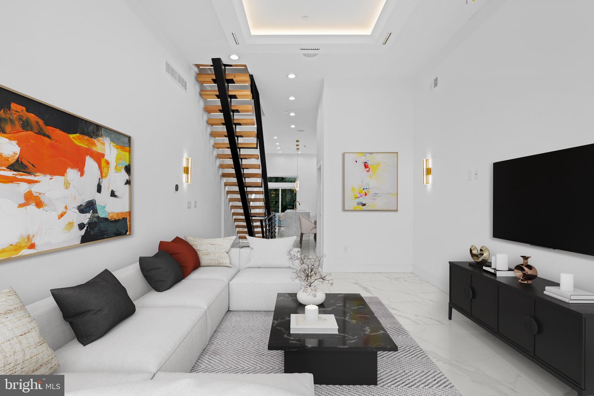 2130 Spring Street Philadelphia, PA 19103 - Photo 6 of 59 a living room with furniture and a flat screen tv