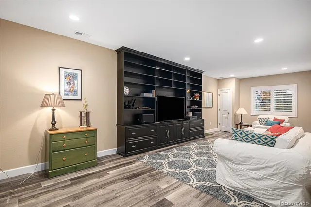 a bedroom with a bed and a television