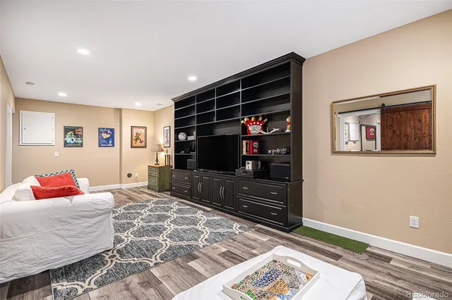 a bedroom with a bed cabinets and window