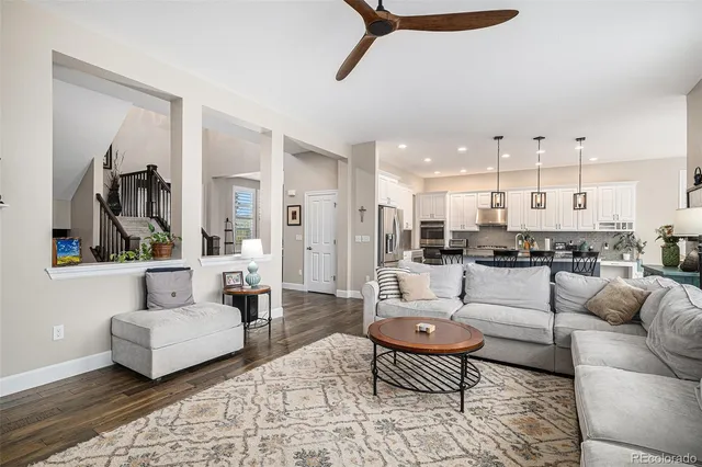 a living room with furniture and a rug