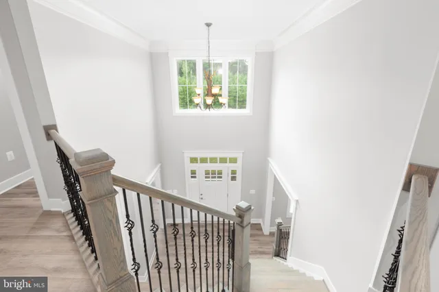 a kitchen with white cabinets and a sink