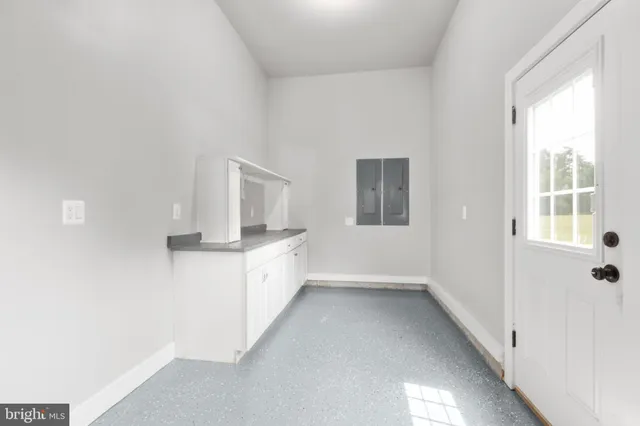 a bathroom with double sink and a mirror