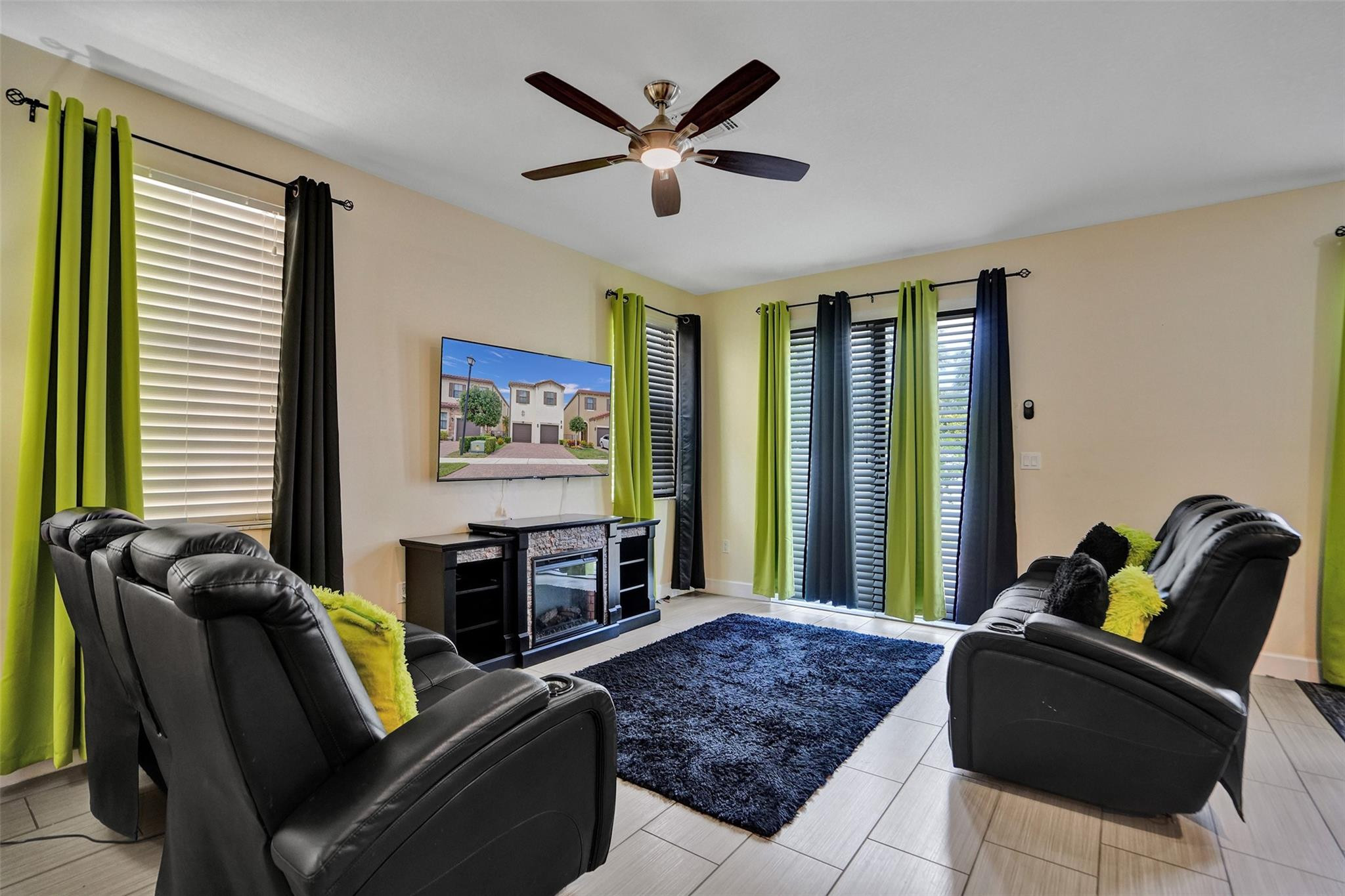 4875 Northwest 55th Place Tamarac, FL 33319 - Photo 11 of 44 a living room with furniture and a large window