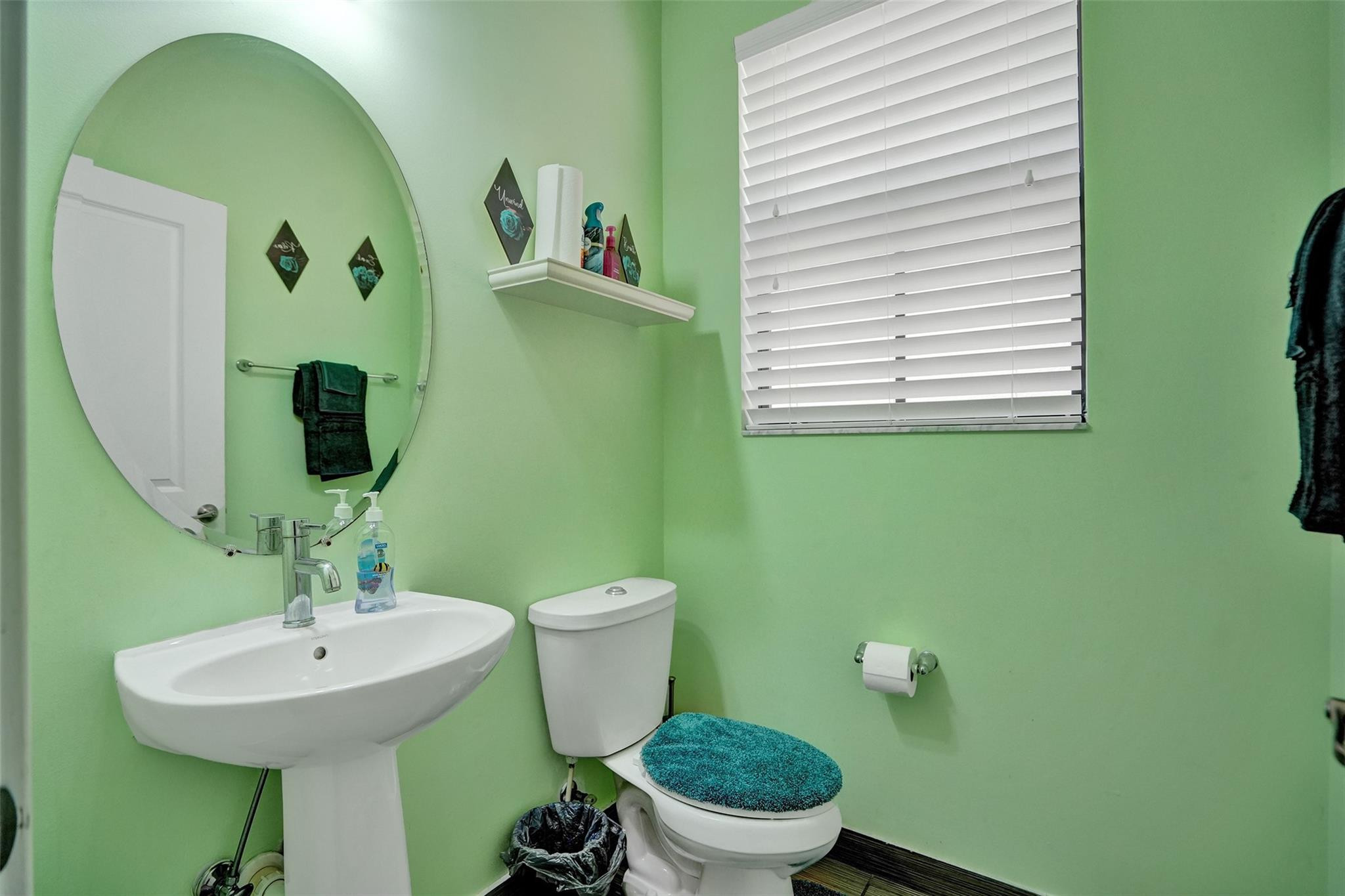 4875 Northwest 55th Place Tamarac, FL 33319 - Photo 22 of 44 a bathroom with a toilet sink and mirror