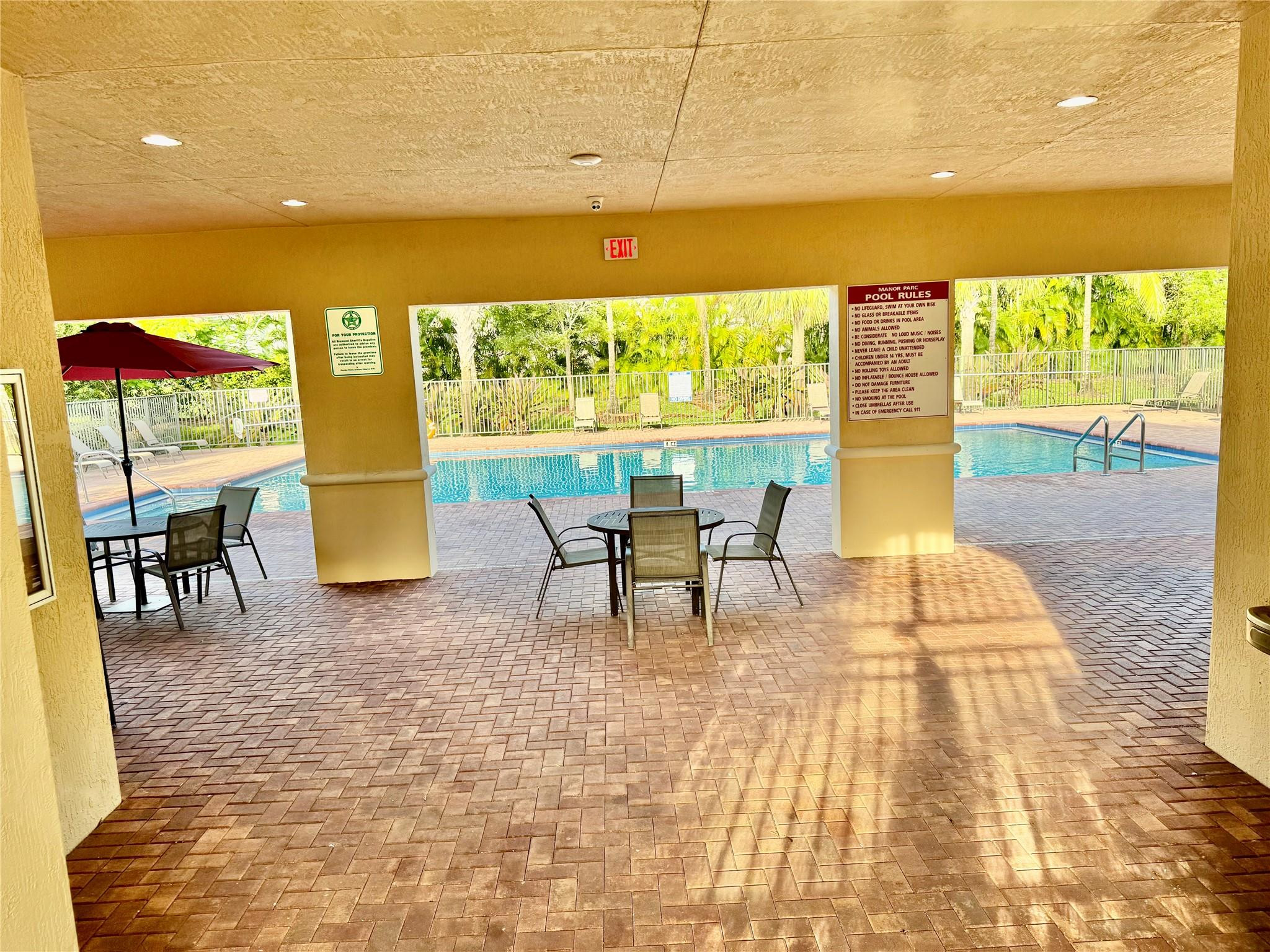 4875 Northwest 55th Place Tamarac, FL 33319 - Photo 40 of 44 a view of swimming pool with furniture