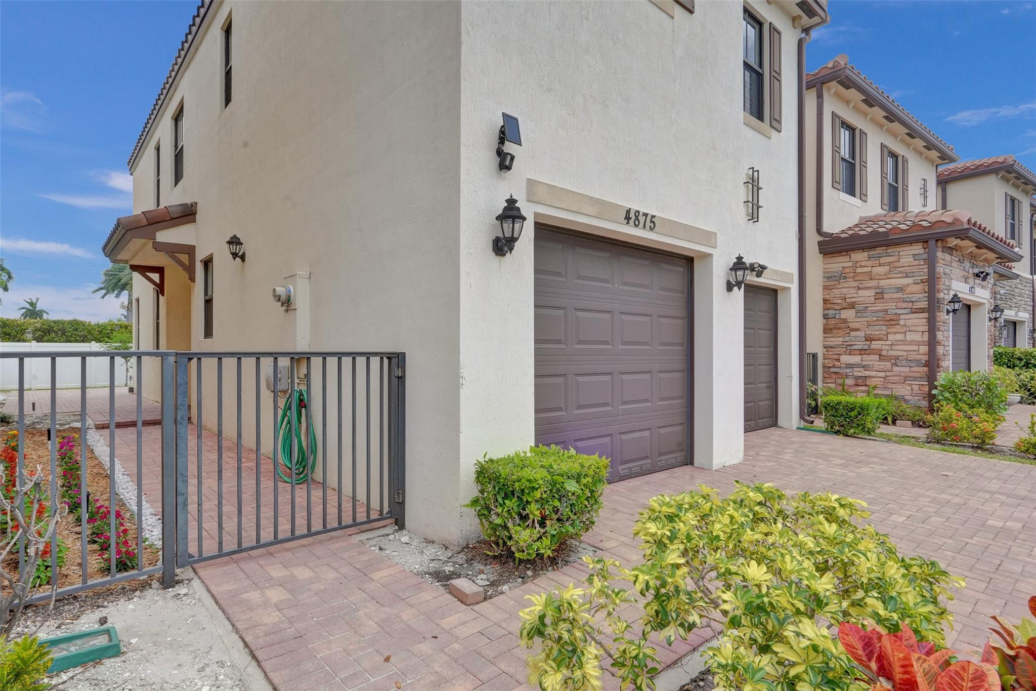 4875 Northwest 55th Place Tamarac, FL 33319 - Photo 4 of 44 a view of a house with a small yard and plants