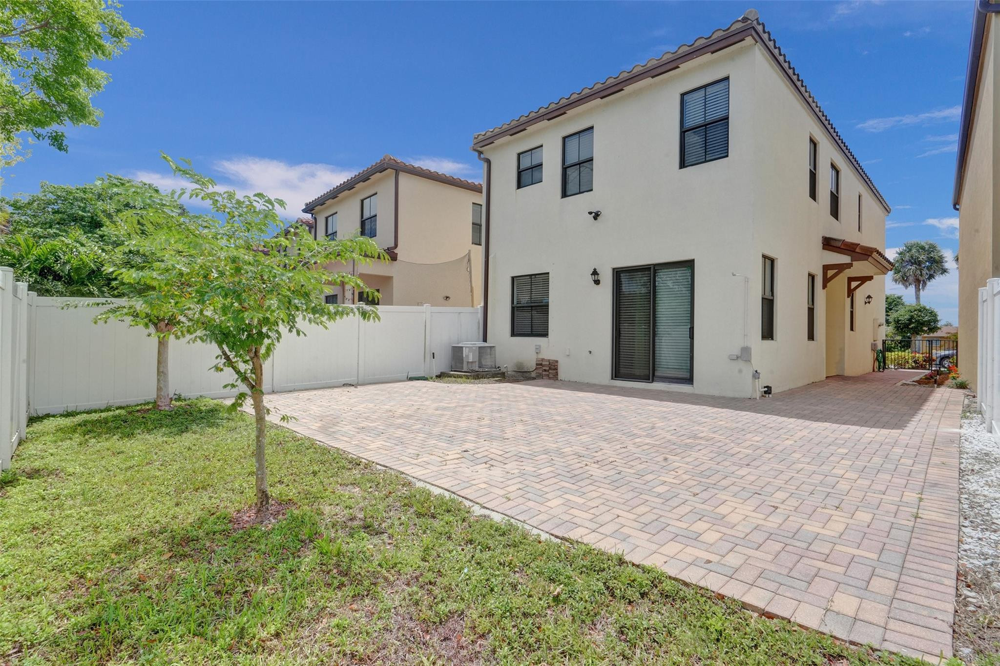 4875 Northwest 55th Place Tamarac, FL 33319 - Photo 8 of 44 a front view of a house with garden